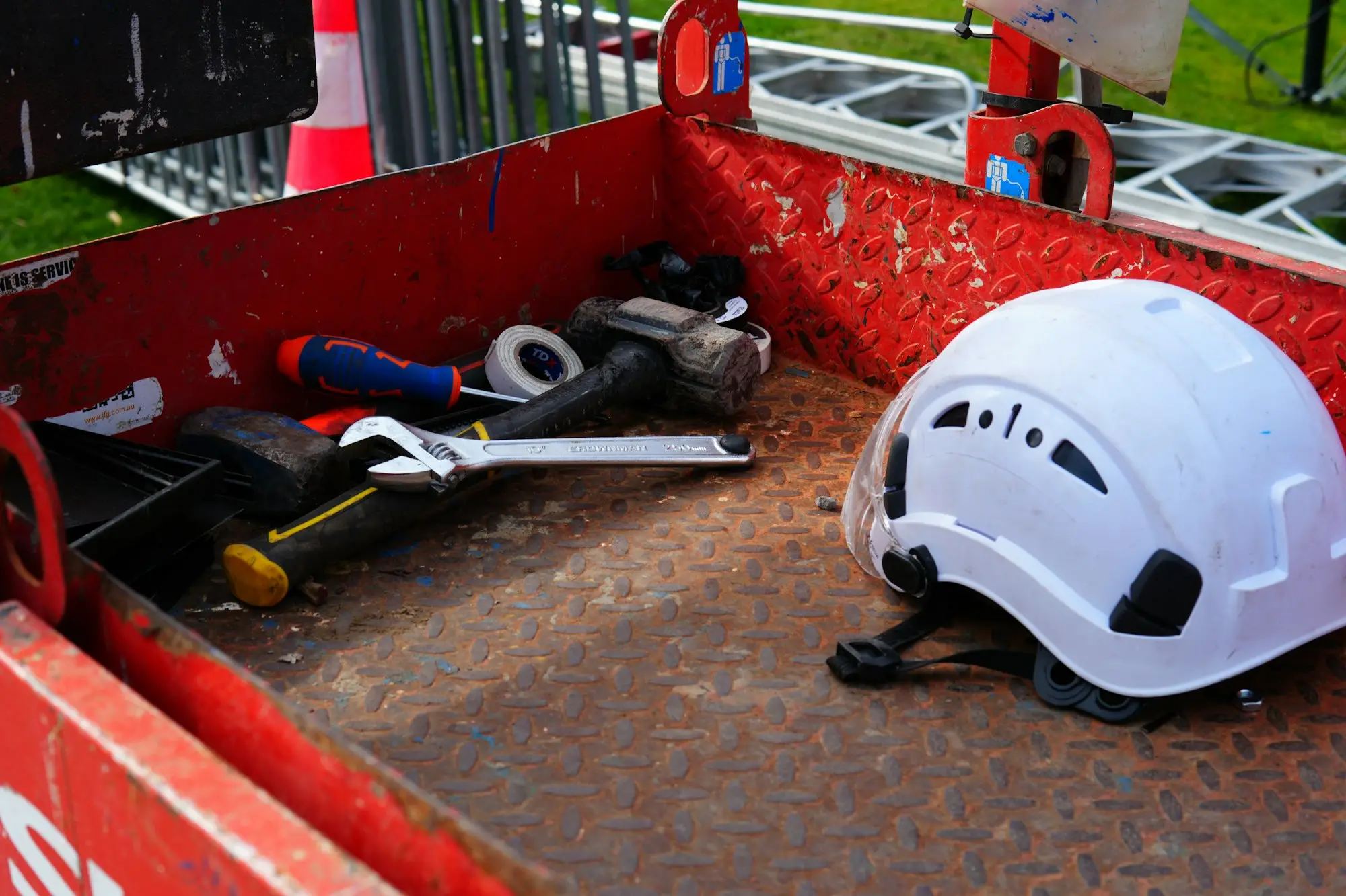 Builder in hi-vis checking plans on a residential building site in Christchurch